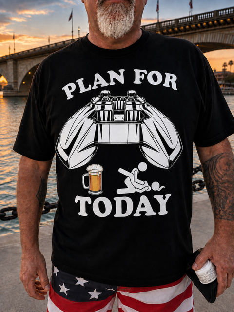 Man wearing black Plan For Today catamaran and beer print t-shirt at London Bridge