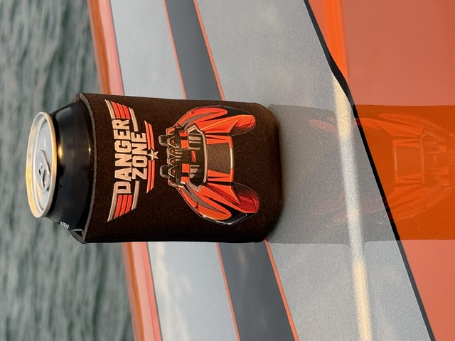 Danger Zone custom can koozie on the deck of a race boat