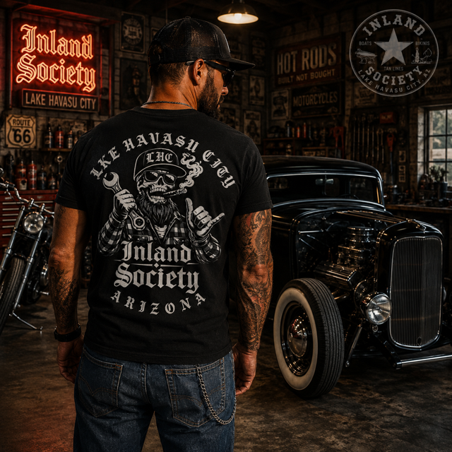Man wearing black Inland Society Arizona skull mechanic t-shirt