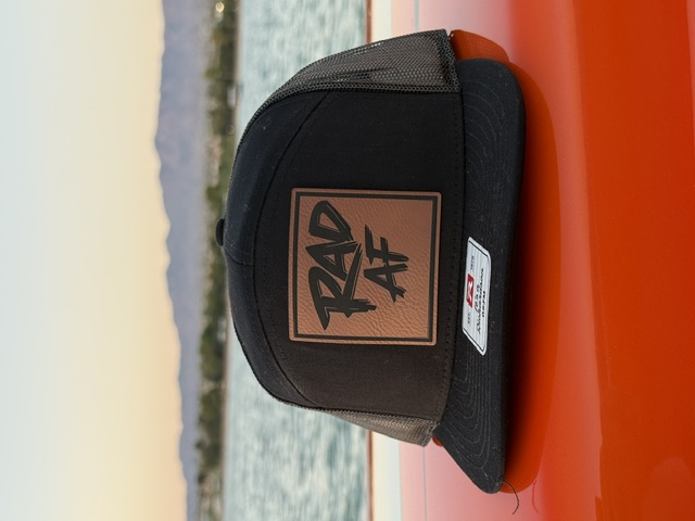 Black trucker hat with RAD AF leather patch