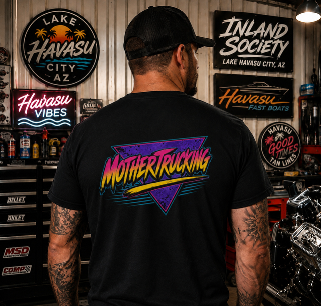 Model wearing a black Mothertruckin t-shirt with a colorful custom truck graphic