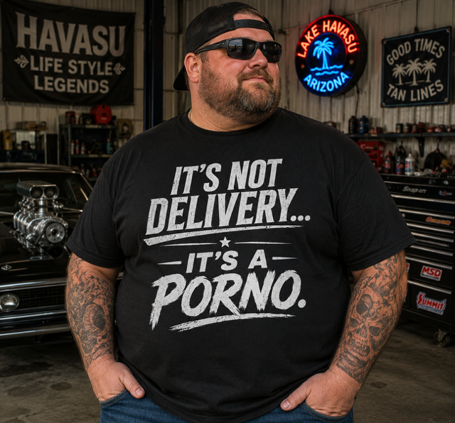 Man wearing black It's Not Delivery It's A Porno t-shirt in a Lake Havasu garage