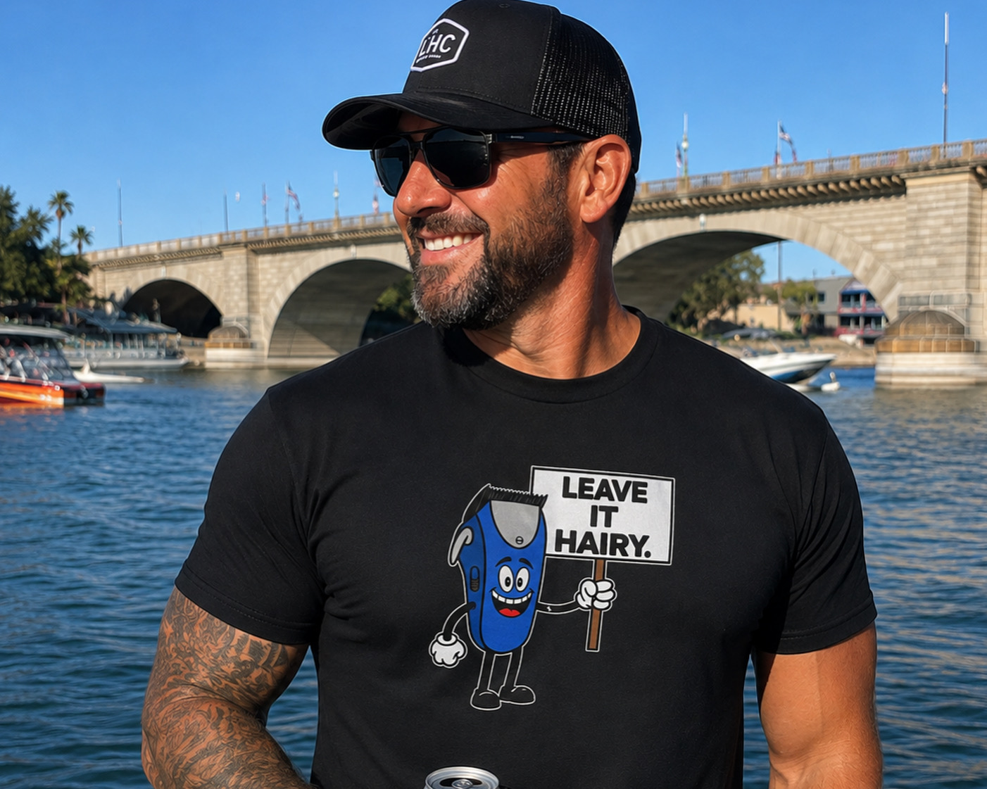 Man wearing a black Leave It Hairy t-shirt by the London Bridge in Lake Havasu City