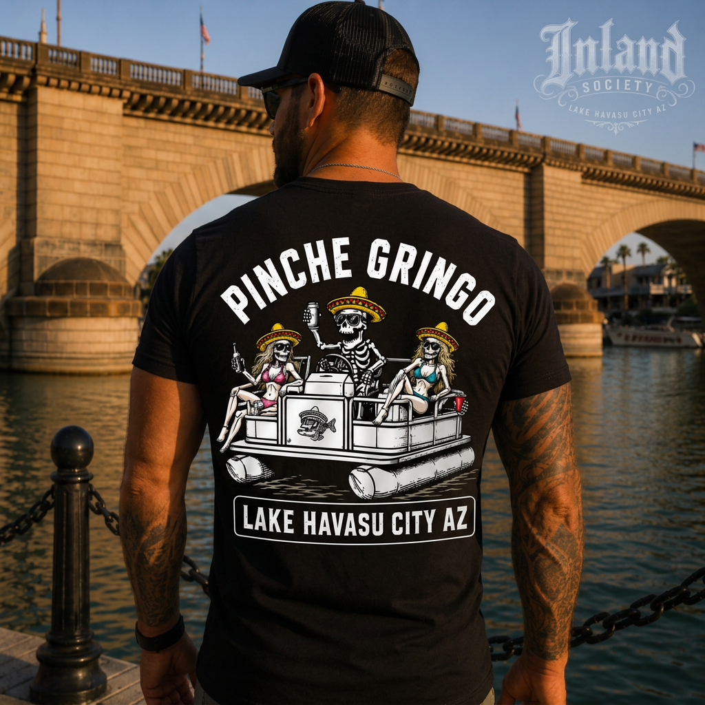 Man wearing black Inland Society Pinche Gringo Lake Havasu City AZ t-shirt at London Bridge